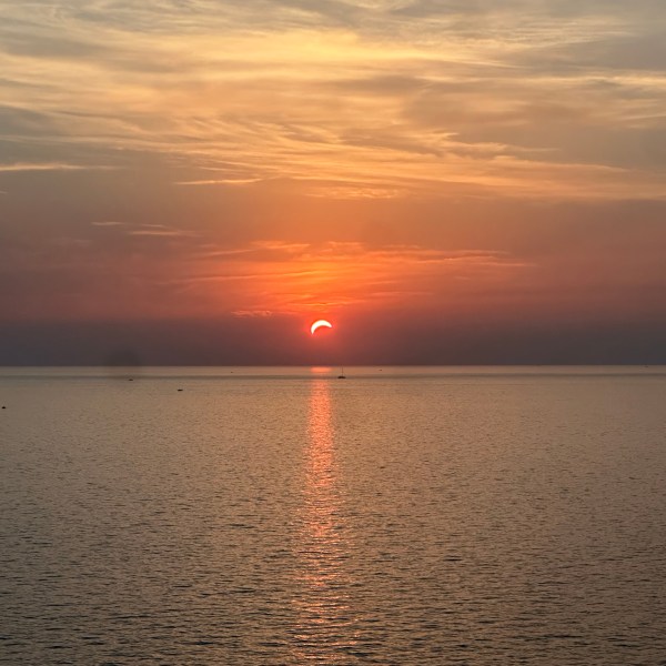 The partially eclipsed sun setting over the Mediterranean, Corsica, 12 August 2026